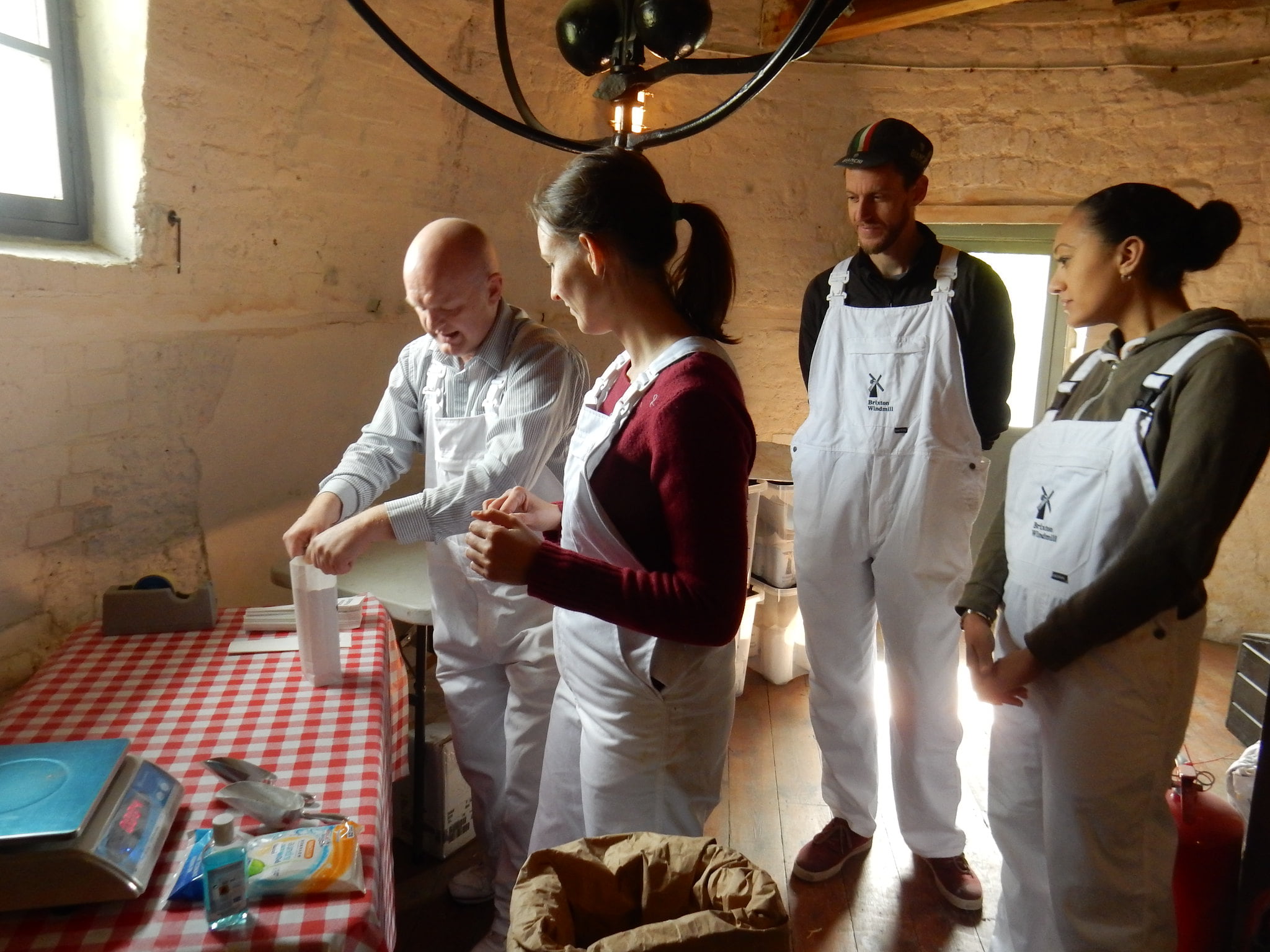 Milling volunteers preparing flour at Brixton Windmill
